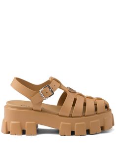 sand beige buckle-fastening ankle strap caged design enamel triangle logo branded leather insole platform sole ridged rubber outsole silver-tone hardware Prada Sandals, Rubber Sandals, Caged Sandals, Estilo Preppy, Buckle Shoes, Triangle Logo, Dolce E Gabbana, Sand Beige, Blue Sandals