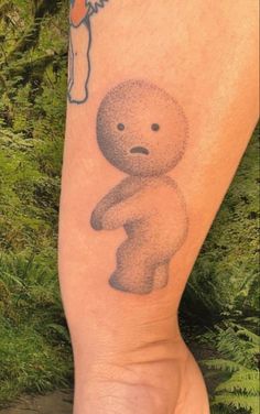 a person with a small tattoo on their leg that has an image of a teddy bear