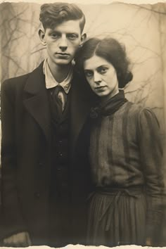 an old black and white photo of two people