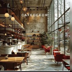 the interior of a restaurant with lots of tables and chairs in front of large windows