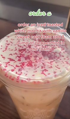 there is a drink with white and red sprinkles on it