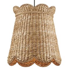 a large woven lamp shade hanging from a ceiling fixture with wicker trimmings