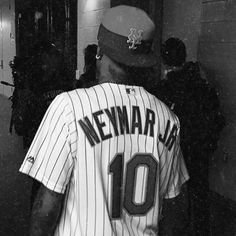 a black and white photo of a baseball player wearing a new york yankees uniform with the number 10 on it