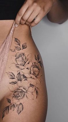 a woman's stomach with flowers on it