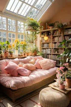 a living room filled with furniture and lots of plants on top of the windowsill