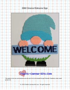 a welcome sign with an image of a person wearing a blue hat and green sweater