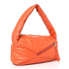 This is an authentic LOEWE Shiny Nappa Puffer Puzzle Hobo in Orange. This stunning bag is crafted of lambskin leather in orange. The bag features a looping leather shoulder strap, a rear zipper pocket, and polished silver hardware. The top zipper opens to a orange fabric interior with a patch pocket. Puzzle Bag, Basket Tote, Orange Fabric, Polish Silver, Bag Light, Blue Bags, Lambskin Leather, Silver Hardware, Electric Blue