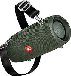 the jbl boom 3 bluetooth speaker is attached to a black strap with an orange tag on it