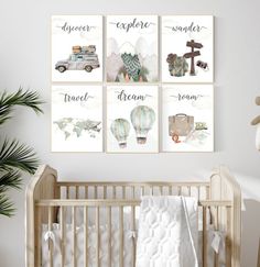 a baby's nursery room with three posters on the wall