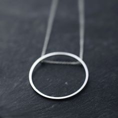 Singular rolling Oh silver necklace by Minicyn on Etsy Modern White Gold Necklaces With Open Circle, Modern White Gold Necklace With Open Circle Design, Modern White Gold Open Circle Necklaces, Modern White Gold Open Circle Necklace, Simple Sterling Silver Everyday Necklace, Simple Sterling Silver Necklace For Everyday, Minimalist Silver Necklace For Everyday, Minimalist Sterling Silver White Gold Necklace, Minimalist White Gold Sterling Silver Necklace