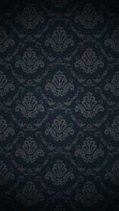 a black and white wallpaper with an ornate design on it's side,