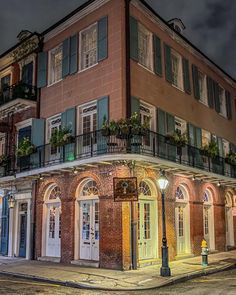 an old brick building is lit up at night