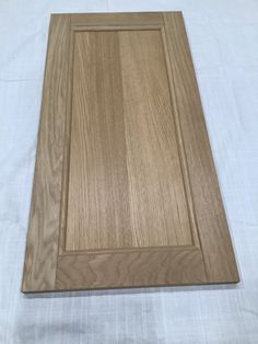 a wooden cutting board sitting on top of a table