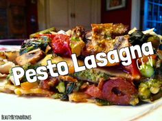 a close up of a plate of food with the words pesto lasagna