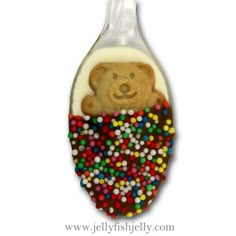 a brown teddy bear in a candy filled bag ornament on a white background