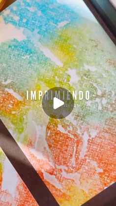 the video is showing how to make an art project with watercolors and ink