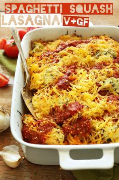 a casserole dish with cheese and tomatoes