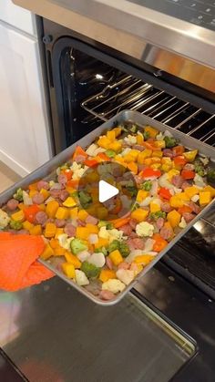 a pan filled with food sitting inside of an oven