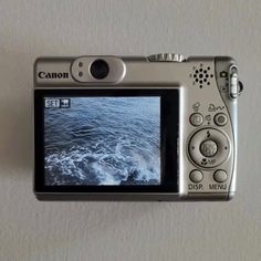 a digital camera sitting on top of a table