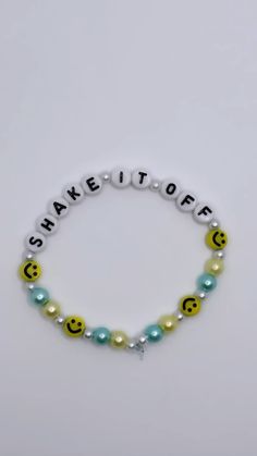 a bracelet with smiley face beads and words that spell out the word, share it off