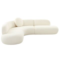 a large white couch sitting on top of a white floor