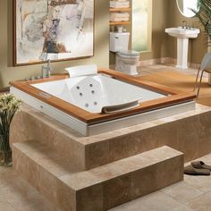 a bathroom with a jacuzzi tub in the middle