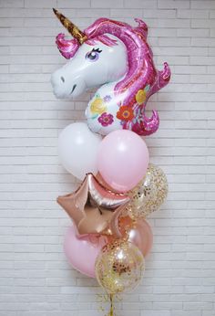 a bunch of balloons that are in the shape of a unicorn