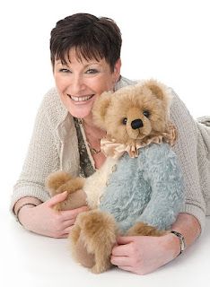 a woman holding a teddy bear in her arms