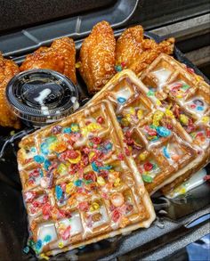 waffles and other food items are sitting on the stove top, ready to be eaten