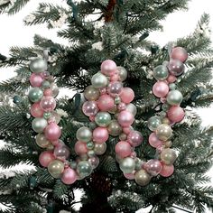 a christmas tree with ornaments hanging from it's branches