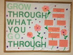 a bulletin board with flowers on it and words written in different languages that read grow through what you go through