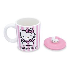 a hello kitty coffee cup and saucer set on a white background with pink stripes