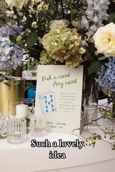 a table with flowers and cards on it