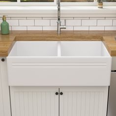 The durable 33-Inch apron front farmhouse double bowl kitchen sink is the perfect complement to any kitchen. A double bowl makes separating wet and dry cookware even easier. The fireclay sinks are molded from a mixture of clay and other minerals together to glazed and fired in a kiln under 2900 °F temperature. Truly glossy and durable ceramic, which is denser and stronger than porcelain. Lordear 50/50 Bowl Farmhouse Apron Front 33-in x 18-in White Fireclay Double Equal Bowl Kitchen Sink Stainles 30 Inch Kitchen Sink, Apron Kitchen Sink, White Farmhouse Sink, Ceramic Kitchen Sinks, White Kitchen Sink, Apron Sink Kitchen, Farmhouse Apron, Sink Grid, Farmhouse Aprons