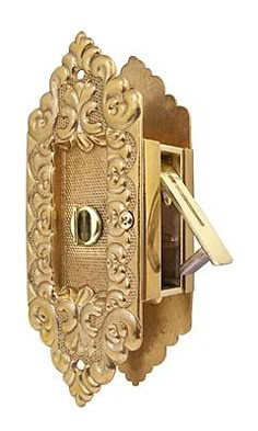 an ornate gold door handle with a key