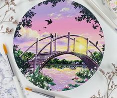 a painting of a bridge with birds flying over it and flowers in the foreground