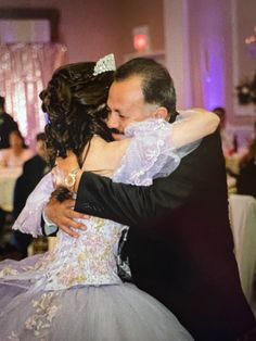 a bride and groom dance at their wedding reception