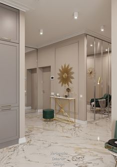 the interior of a modern apartment with marble flooring and gold accents on the walls