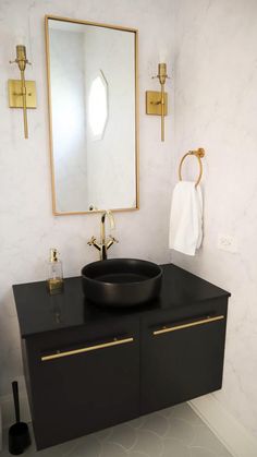 a bathroom with a sink, mirror and toilet