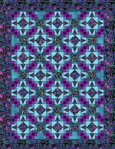 a blue and purple quilt with an intricate design