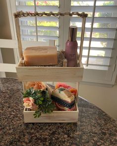 soaps, candles and flowers sit on a counter top