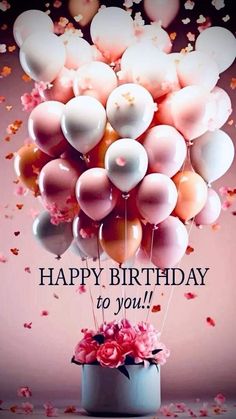 a birthday card with balloons and flowers in a vase on a table next to confetti