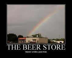 a rainbow is in the sky above a building with a sign that says beer god wants you to drink it