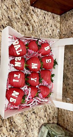 a bunch of strawberries in a box with the words happy birthday written on them