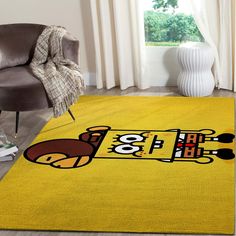 a yellow area rug with a cartoon character on it