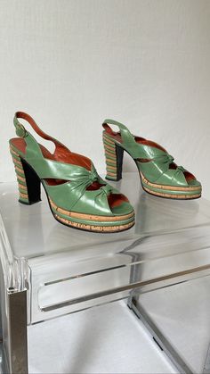 1970's Casuccio & Scalera light green leather and cork platform sandals.  Size IT37 Heel: 10 cm / 3,9'' Platform: 2,5 cm / 0,9'' Sole: 23,5 cm / 9,2'' Material: Leather, Cork Great vintage condition. Vintage Green Round Toe Heels, Vintage Green Heels With Round Toe, Cork Heels With Wooden Heel And Round Toe, Vintage Sandals With Sculpted Heel For Summer, Spring Cork Heels With Round Toe, Green Open Toe Heels With Wooden Heel, Green Heels With Wooden Heel For Spring, Spring Green Heels With Wooden Heel, Retro Green Leather Heels