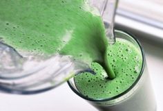 green liquid being poured into a blender