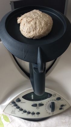 a doughnut sitting on top of an electric device