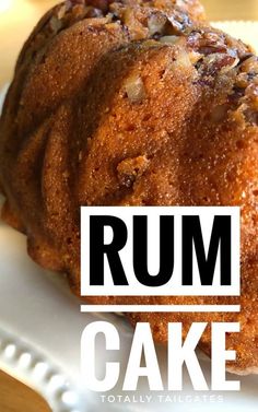 a close up of a cake on a plate with the words rum cake above it