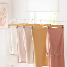 four towels hanging on a clothes line in front of a window